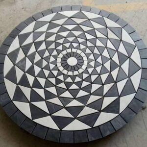 A beautifully crafted stone medallion showcasing intricate patterns.