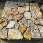 Collection of irregular flagstone pavers in various shapes and colors