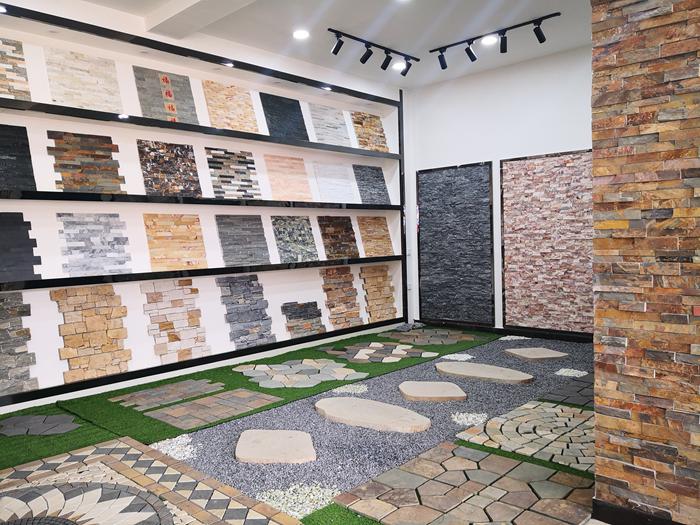 Display of diverse natural stacked stone veneers in showroom