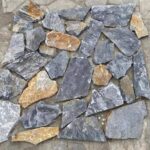 Variety of irregular flagstone pavers in different shapes and colors for landscaping