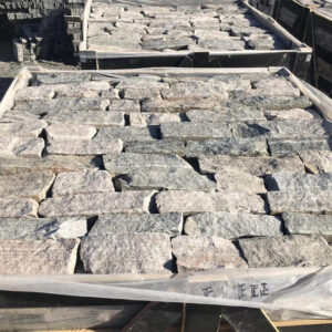 Durable dry stack stone retaining wall for landscaping