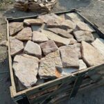Collection of irregular flagstone pavers in various shapes and colors