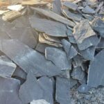 A collection of irregular flagstone pavers in various colors and textures.