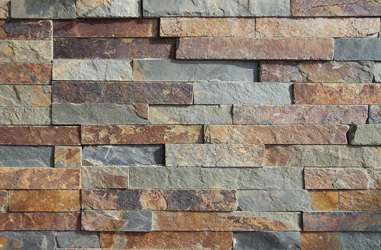 Decorative stacked stone backsplash in a modern kitchen
