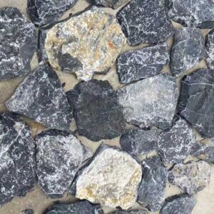 Irregular random loose stone wall veneer construction.