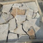 Variety of irregular flagstone pavers in various colors and textures.