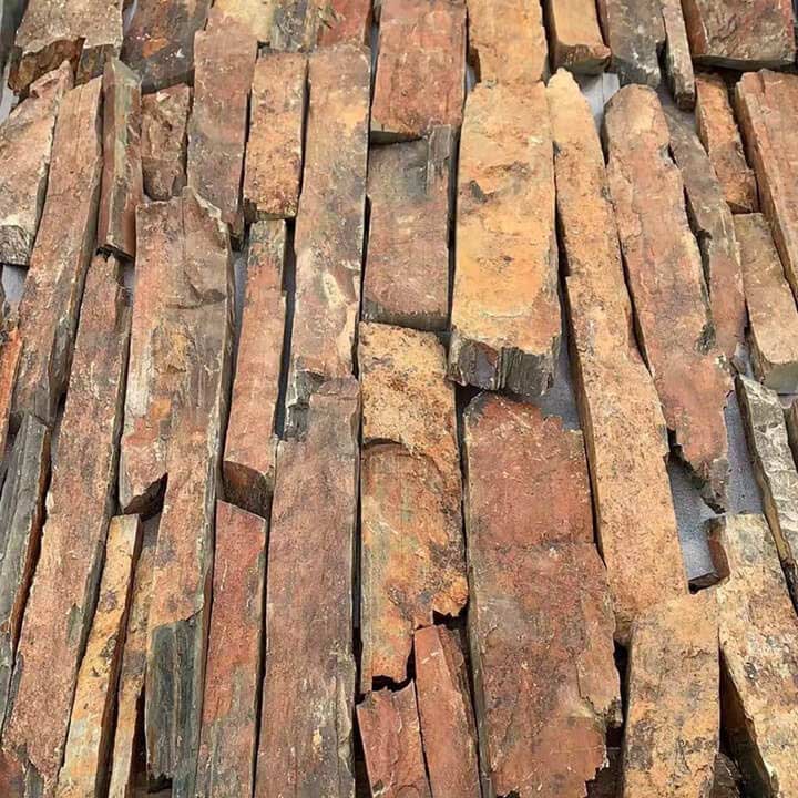 Close-up view of rusty loose cladding panel showing wear and texture