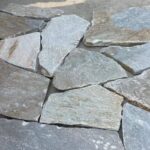 Variety of irregular flagstone pavers showcasing diverse textures and colors