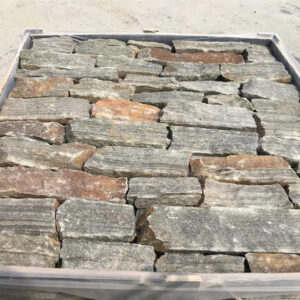 A close-up view of natural dry stack stone veneer in various shades