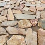 Collection of irregular flagstone pavers in various shapes and sizes.