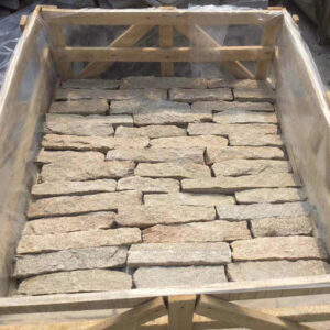 A close-up view of rustic dry stack stone used in construction