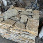 Variety of irregular flagstone pavers in earthy tones
