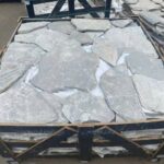 Collection of irregular flagstone pavers in varying shapes and colors