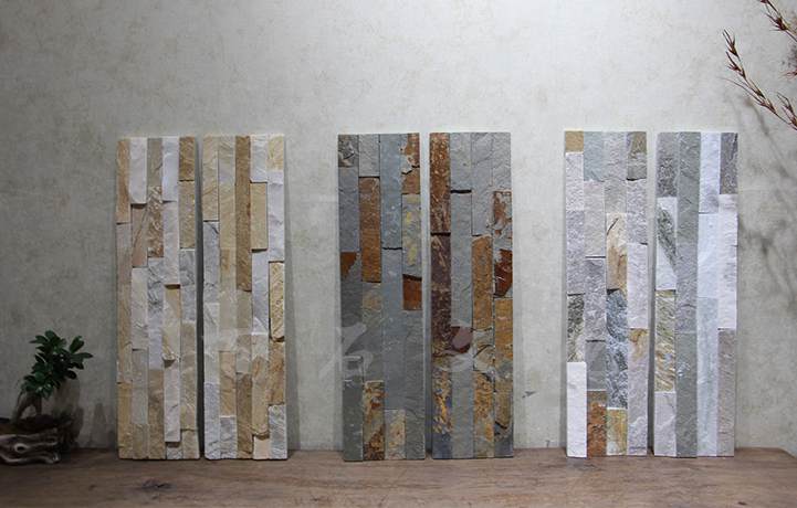 Close-up view of natural stacked stone panels in various colors and textures