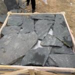 Variety of irregular flagstone pavers showcasing unique shapes and colors