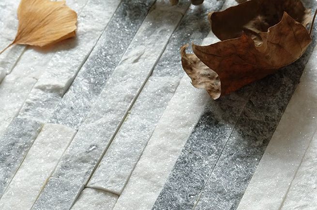 A close-up view of Alaska Gray Ledger Stone panels with textured surfaces