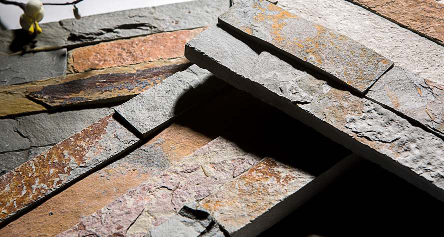 Natural cut stacked stone panels in earthy tones for interior and exterior wall cladding