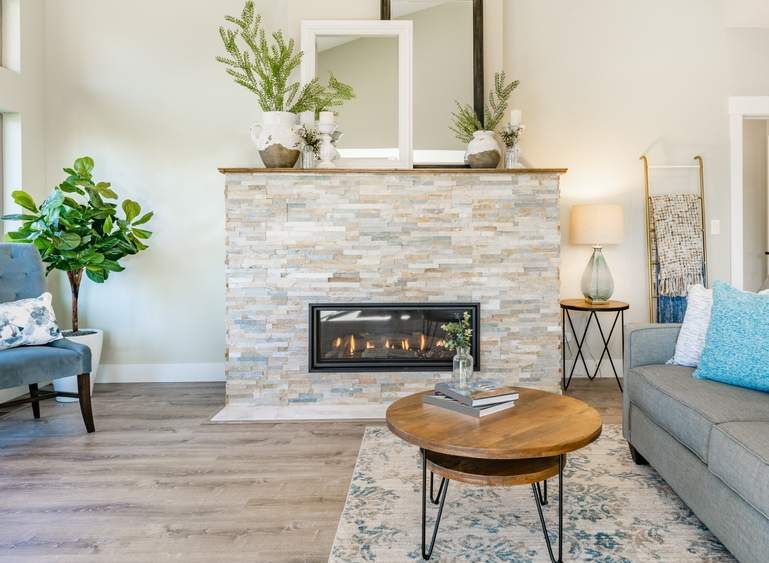 Beautifully installed ledger stone fireplace with warm ambiance.