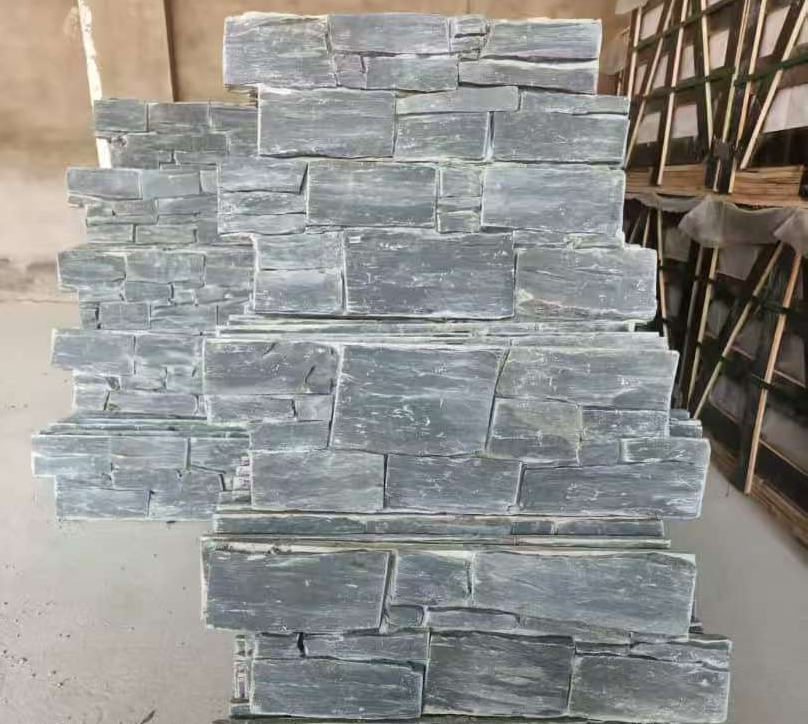 Stacked black slate stone panels for wall cladding, ideal for interior and exterior design