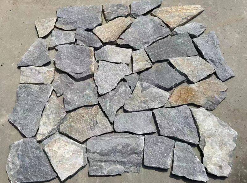 Collection of irregular flagstone pavers in natural tones for landscaping