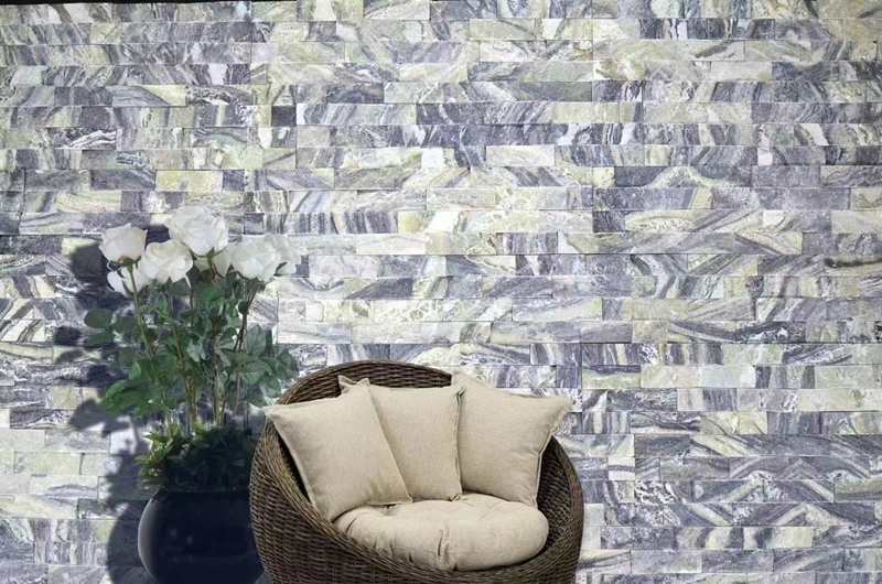 Professional installation of stacked stone in a modern setting