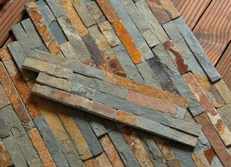 Stacked stone installation around a window for a stylish, modern exterior design