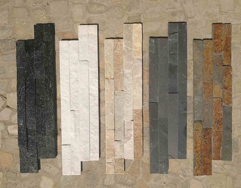 A close-up of split face wall tiles made of stacked stone, showcasing their textured surface.