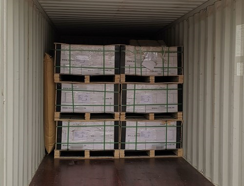Warehouse showcasing containers filled with culture stones