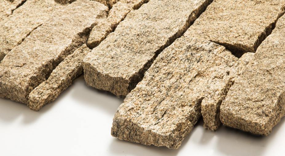 Stacked stone veneer panels installed on an interior wall, highlighting texture and design