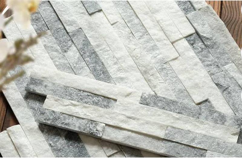 Installing stacked stone around a window for a decorative and natural look