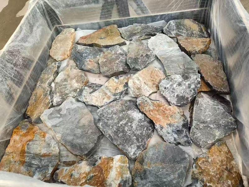 Stacked thin stone veneer panel in natural earth tones for wall cladding