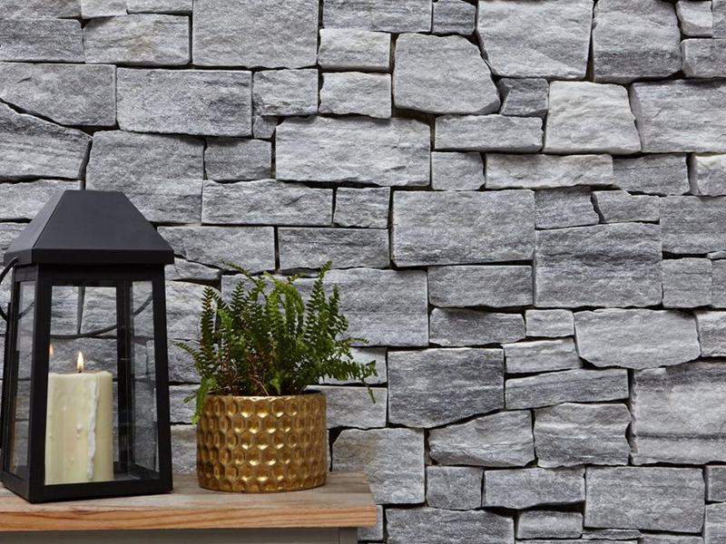 Maintaining exterior natural stone cladding on a building facade