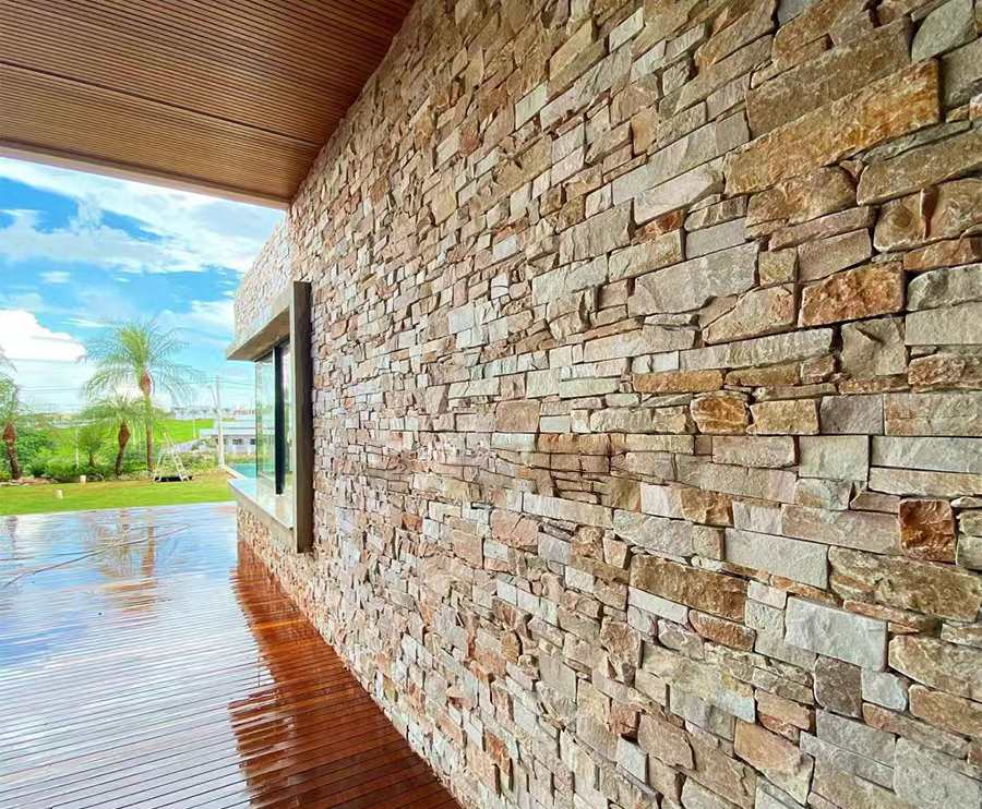Close-up view of natural stone cladding with textured surfaces